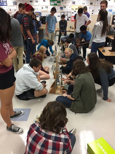 Students with science equipment